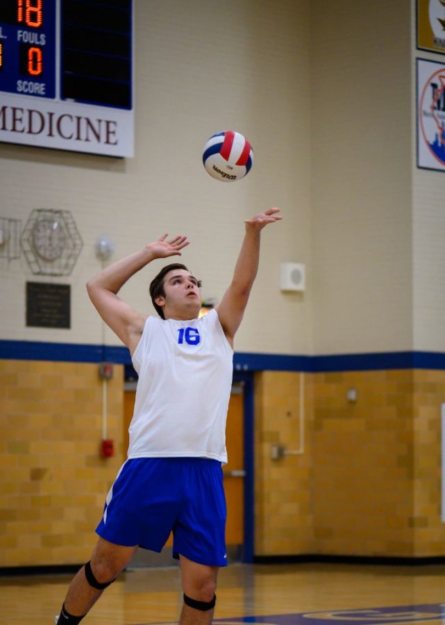 Matt Hanson during a RB volleyball game hitting a spike shot.