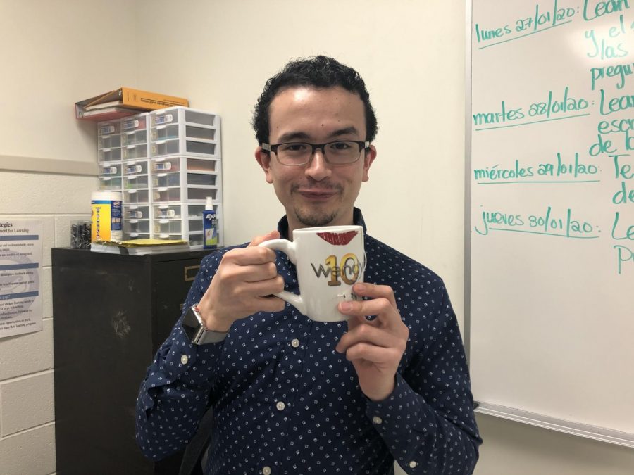 Juan Tinoco making one of his signature reaction faces while holding his Wendy Williams mug.