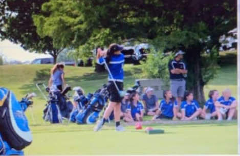 Elizabeth Centorcelli hitting her tee shot during a match.