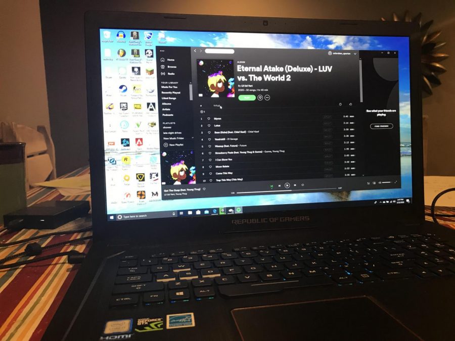 A picture of my laptop with spotify open to Eternal Atake.