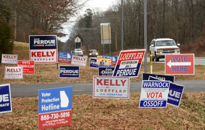 Senators Kelly Loeffler and David Perdue faced off against Democratic challengers Reverend Raphael Warnock and Jon Ossof (respectively) in the state of Georgia. Photo by Yahoo News