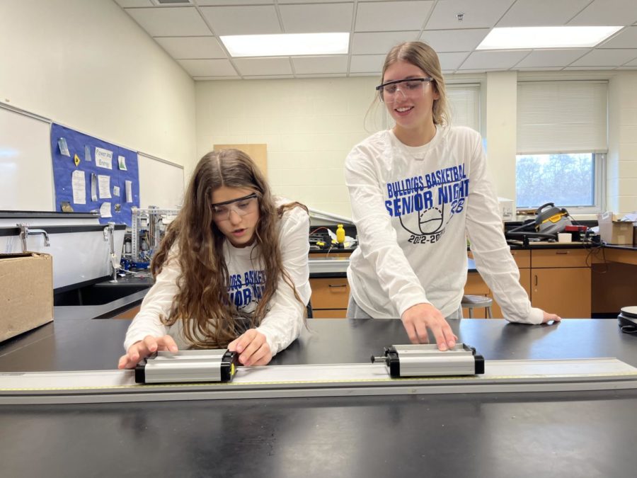 Niamh Larson (left) and Emily Organ (right) work on a science lab project. Photo taken by Nikki Tinerella.