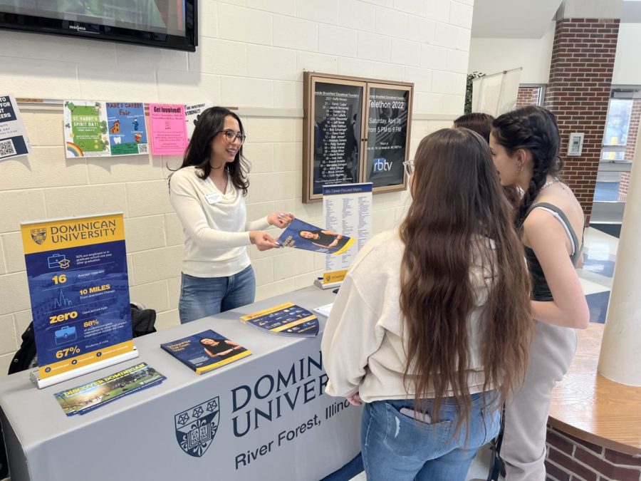 A representative from Dominican University in River Forest, Illinois provides students with information.