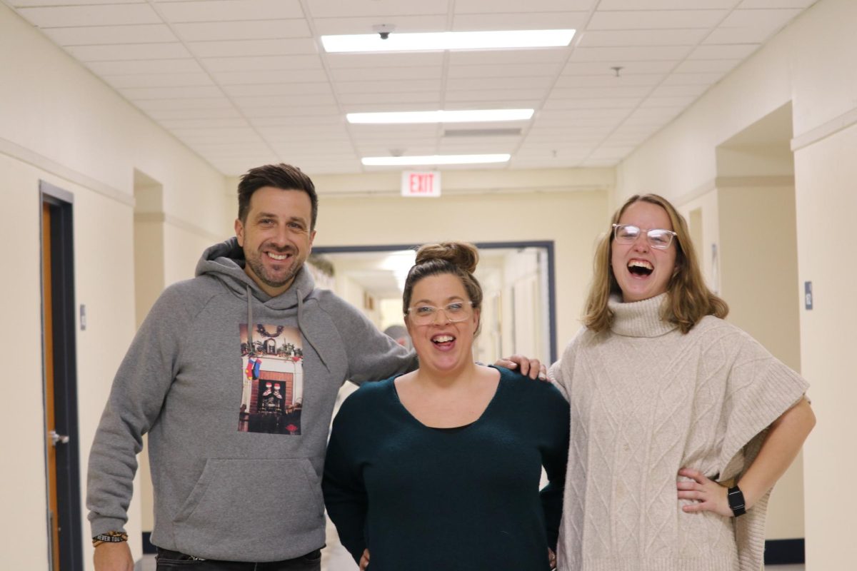 RB new staff (from l. to r.): Matthew Holdren, Kendra Cagle, Mia Pitzaferro pose in the hallway.