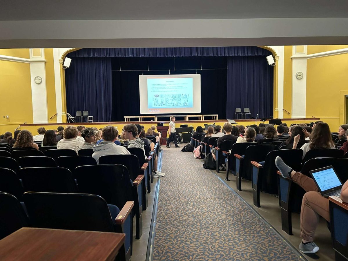 RB students in auditorium for a senior essay writing presentation.