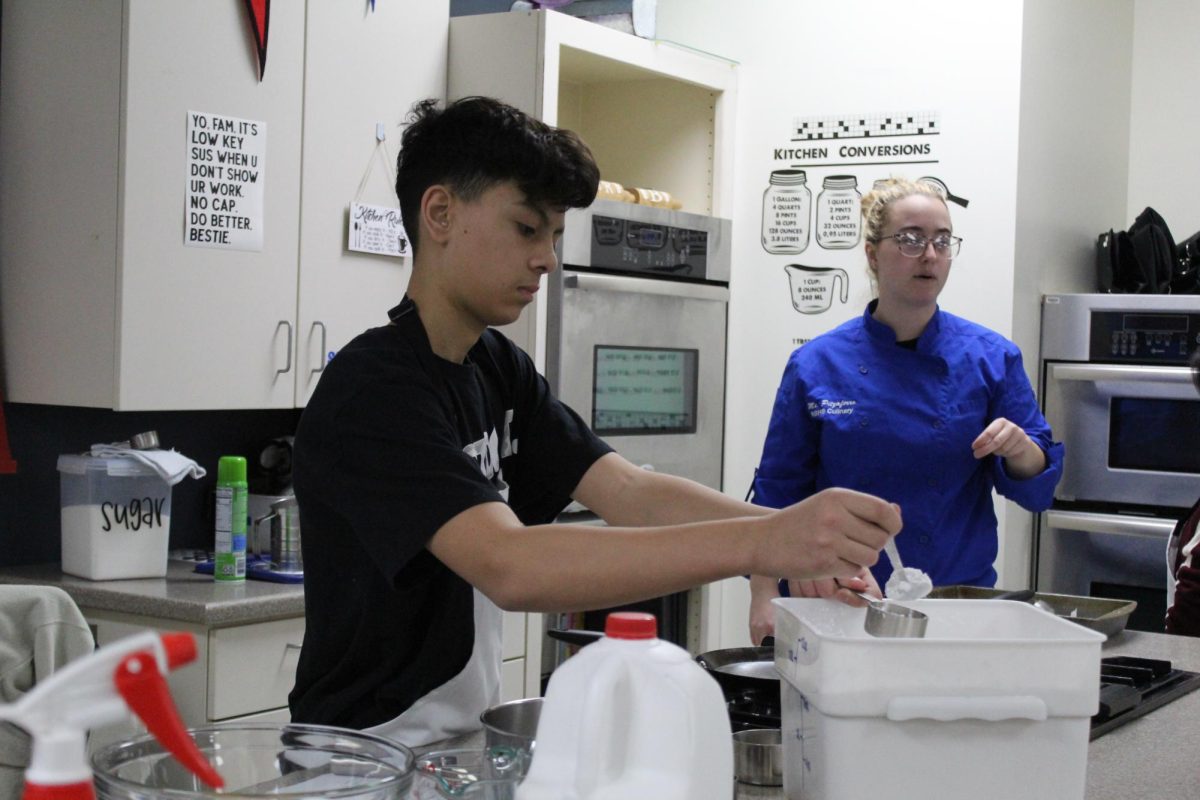 Students in their Foods I class working on an in class assignment.