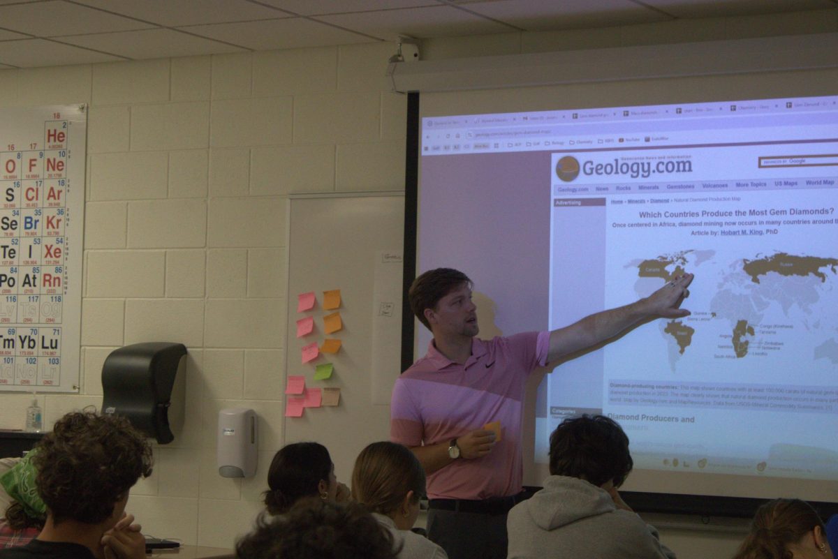 Charles Pozen teaching geography during class.